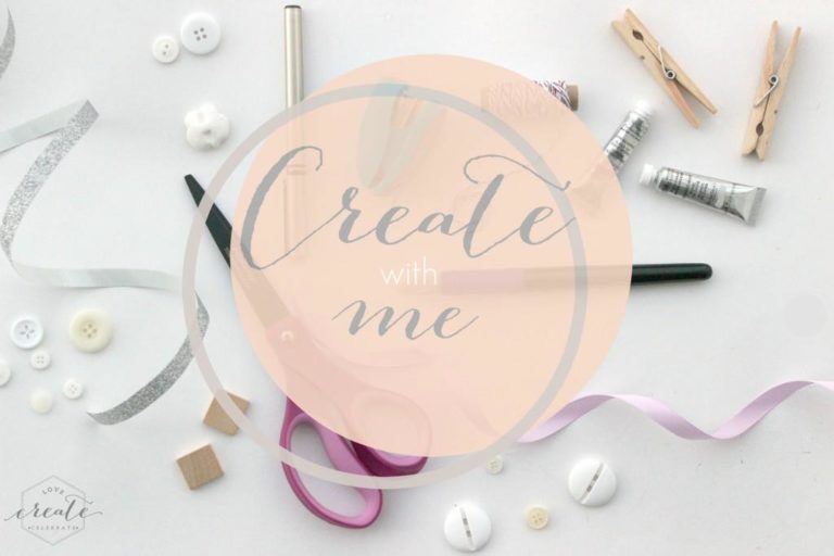Ribbons, buttons, scissors, and other craft supplies is laid out on a white background. A peach-colored circle in the middle of the image has text in the center that reads "create with me"